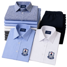 School shirts manufactured in Tirupur by Ajna Clothings for boys and girls with custom colours, checks, stripes and plain fabric options